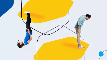 Zwei Personen auf gelbem Hintergrund, eine steht auf dem Kopf.