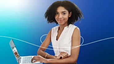 A lady holding a laptop with a gradient blue background.