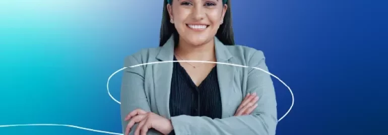 A lady in an office attire smiling on a blue gradient background.