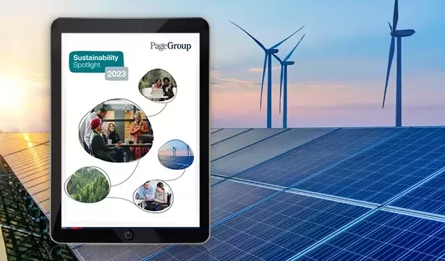 A tablet with solar panels in the background.